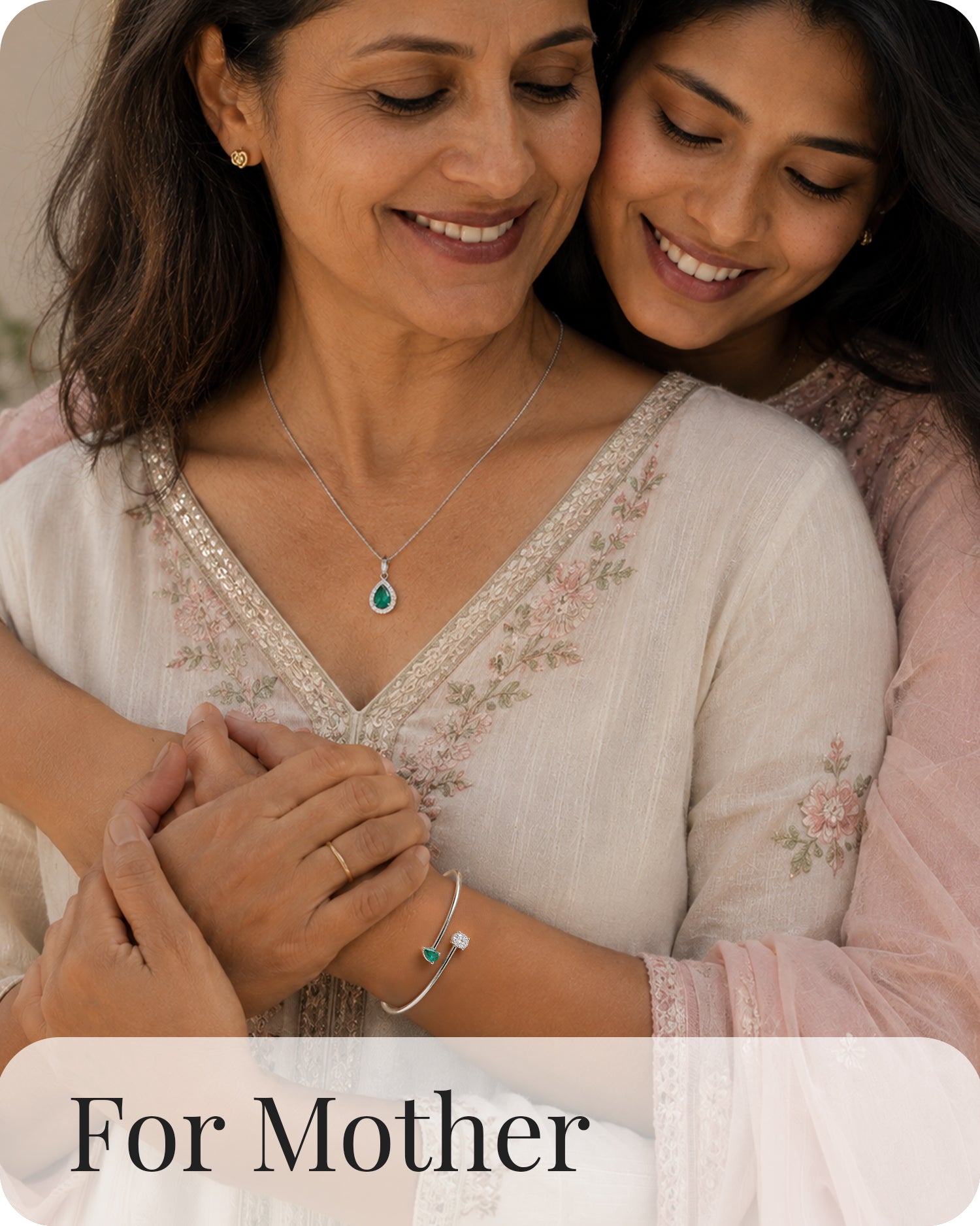 Mother and daughter wearing emerald cz pendant necklace and american diamond bracelet jewelry gift for mom family jewelry