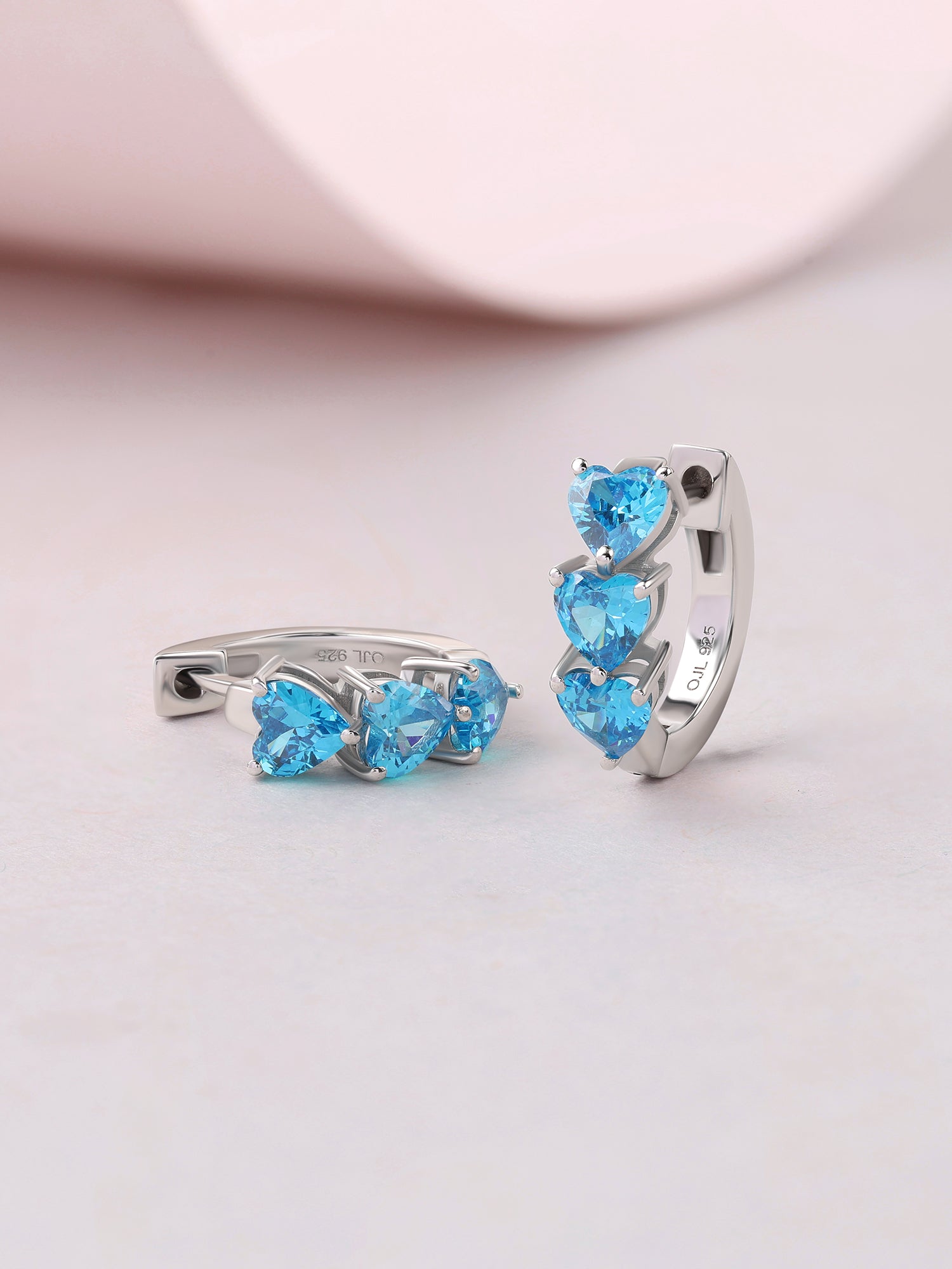 Silver Blue Topaz CZ Twin Heart Huggie Earrings