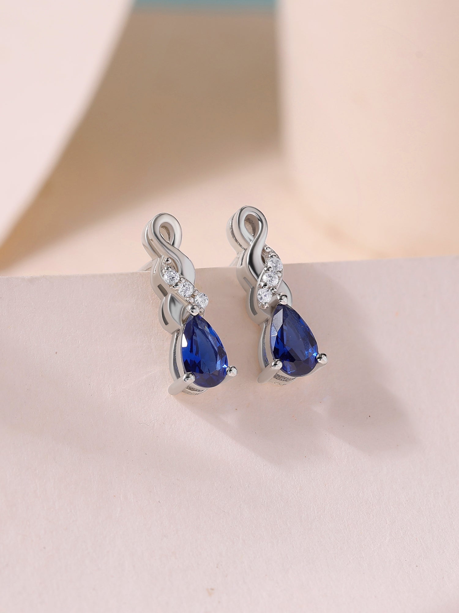 Infinity Twist Blue Sapphire CZ Silver Earrings for Women